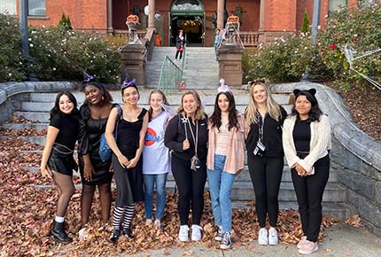 Students posing in Halloween costumes