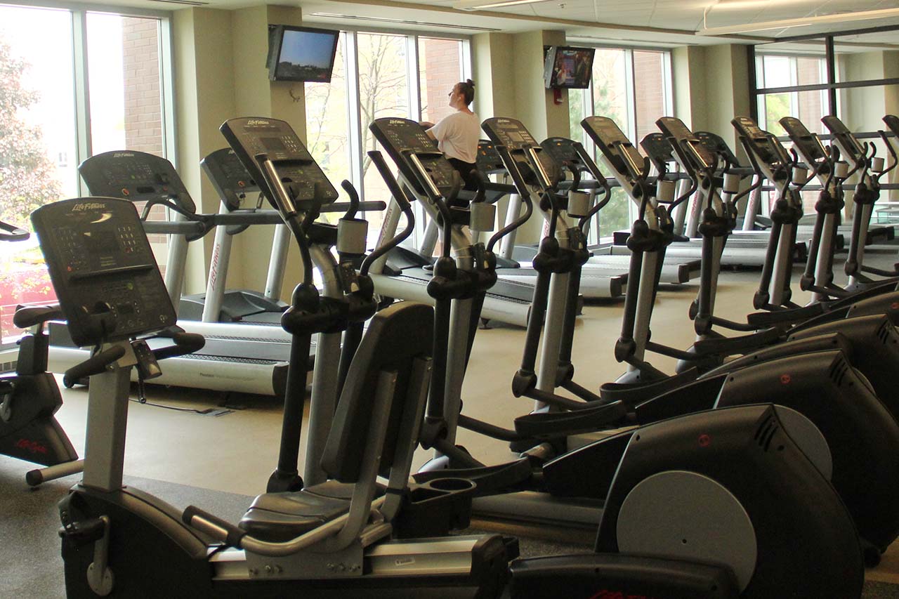 student using treadmill